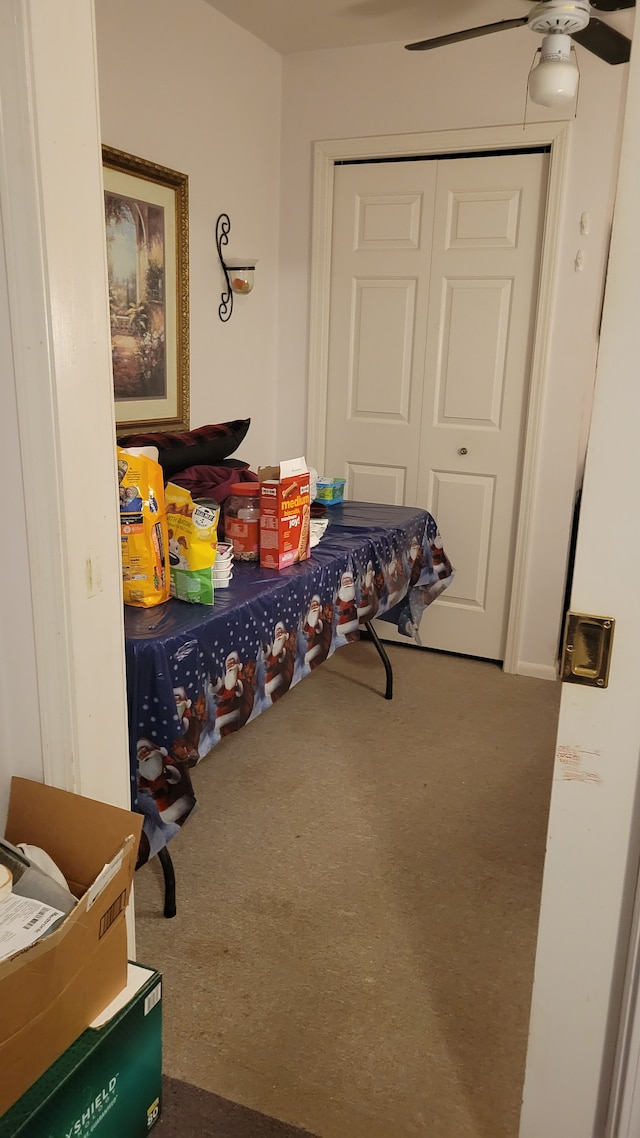 bedroom with carpet flooring, ceiling fan, and a closet