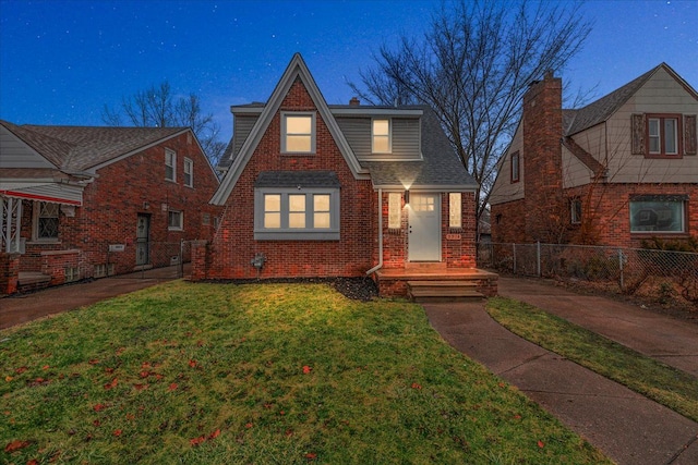 tudor house featuring a yard