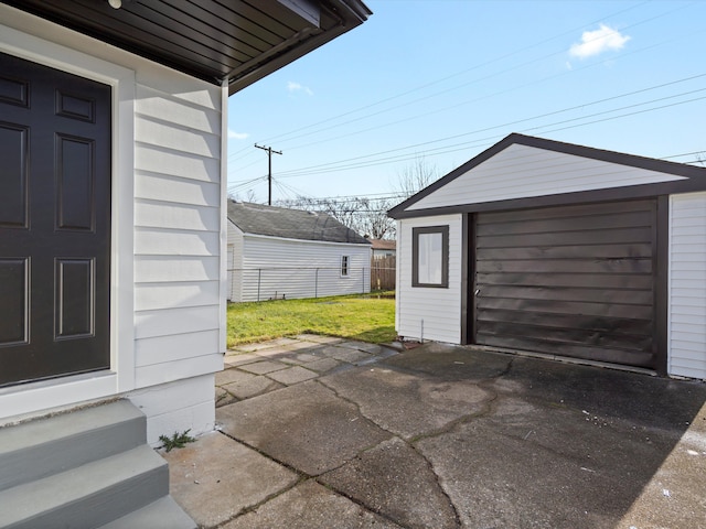 view of patio with an outbuilding