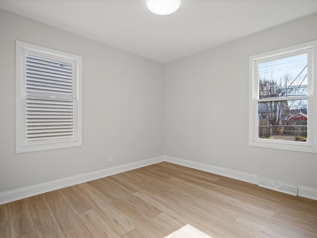 spare room with light wood-type flooring