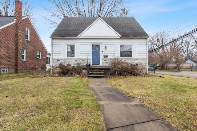 bungalow with a front yard