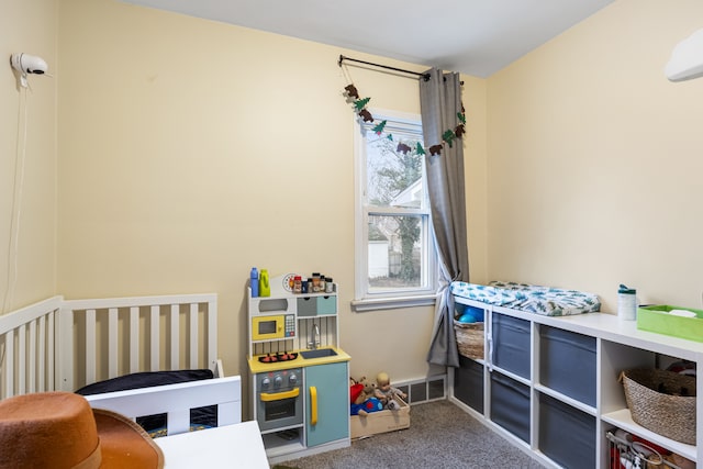 carpeted bedroom with a crib