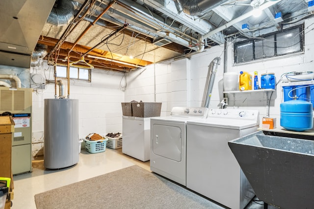 clothes washing area with independent washer and dryer, gas water heater, heating unit, and sink