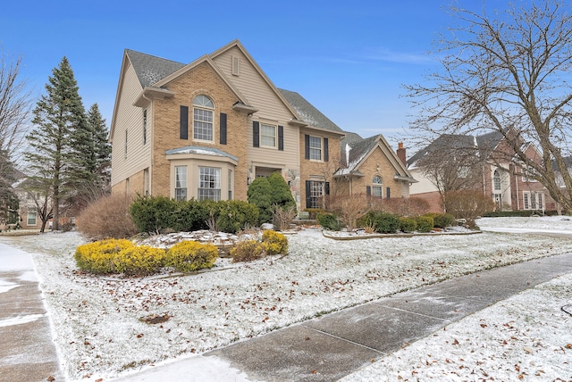 view of front of house featuring brick siding