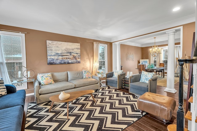 living area featuring dark wood-style floors, decorative columns, and a wealth of natural light