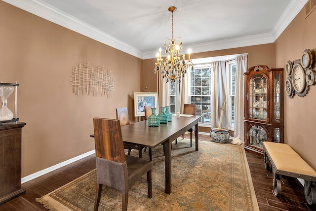 dining space with an inviting chandelier, baseboards, dark wood finished floors, and crown molding