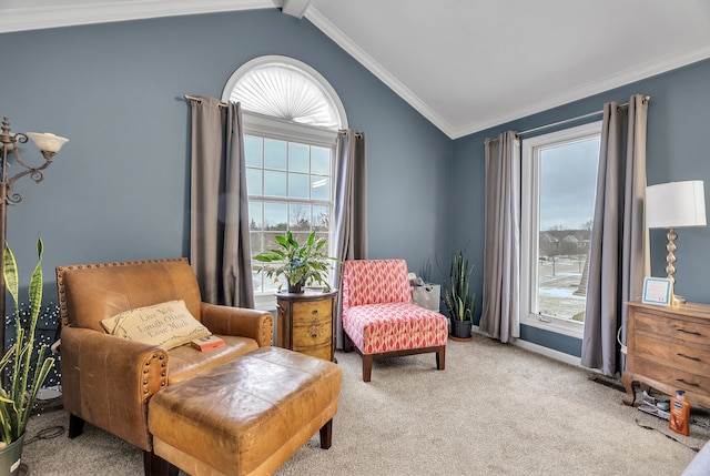 sitting room with ornamental molding, light colored carpet, and vaulted ceiling