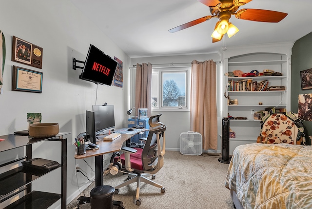 carpeted bedroom featuring baseboards and a ceiling fan