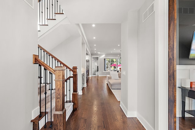 foyer entrance featuring dark hardwood / wood-style floors