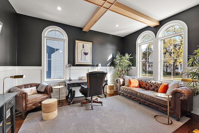 home office with dark hardwood / wood-style flooring and beamed ceiling