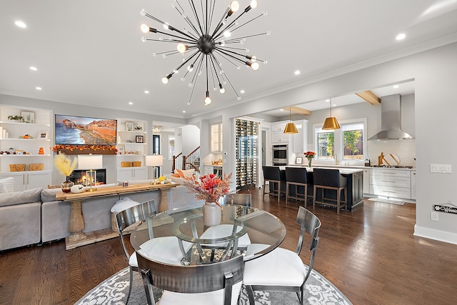 dining area with dark hardwood / wood-style flooring, built in features, a notable chandelier, and crown molding