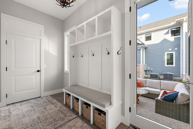 mudroom with a notable chandelier and a healthy amount of sunlight