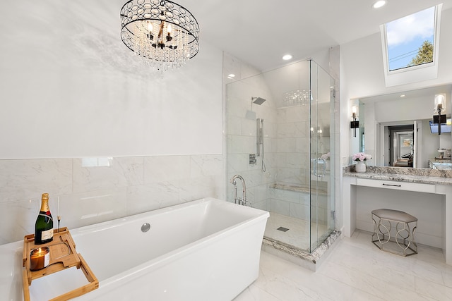 bathroom with vanity, plus walk in shower, and a chandelier