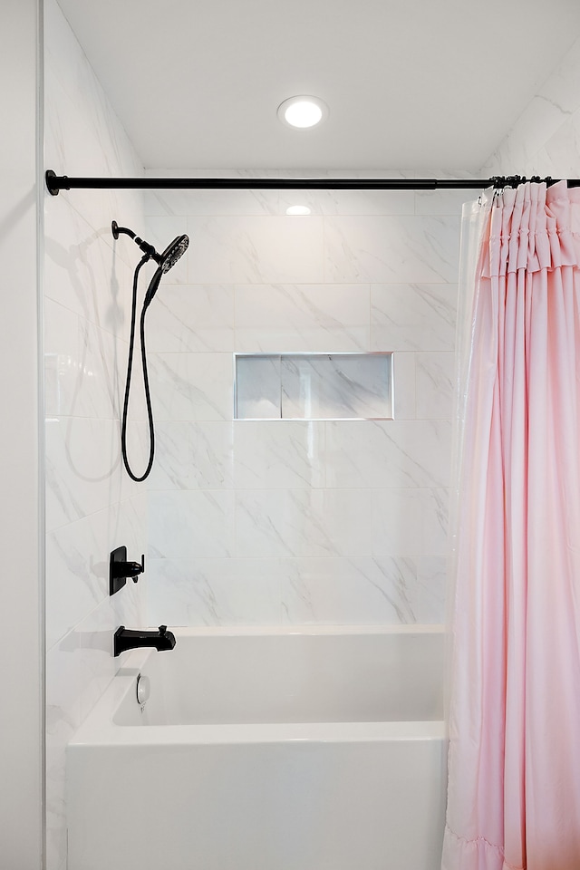 bathroom featuring shower / bathtub combination with curtain