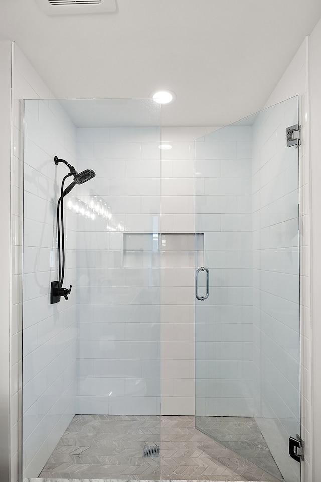 bathroom featuring an enclosed shower