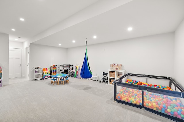 game room with light colored carpet