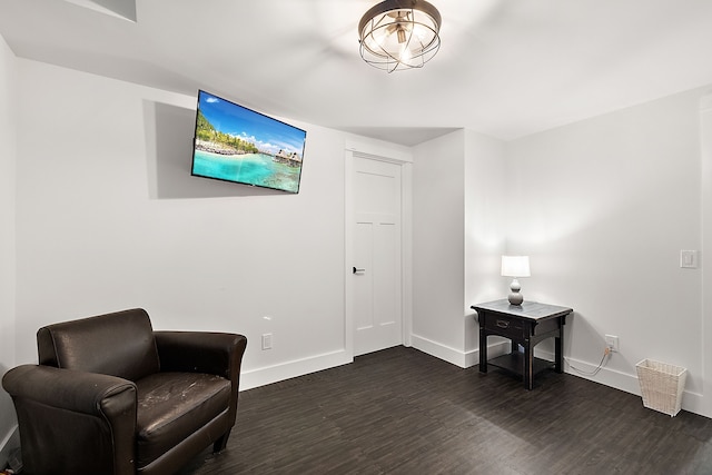 sitting room with dark hardwood / wood-style floors