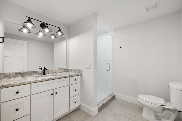 bathroom with tile patterned flooring, a shower with door, vanity, and toilet