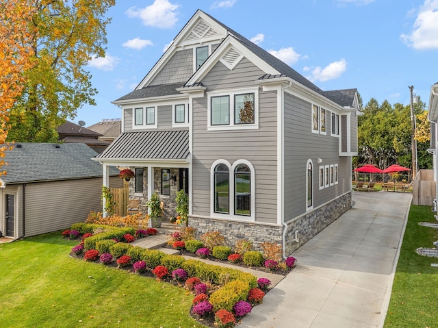 craftsman-style house with a front lawn