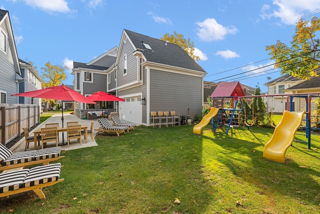 exterior space featuring an outdoor living space, a playground, a patio, and a yard