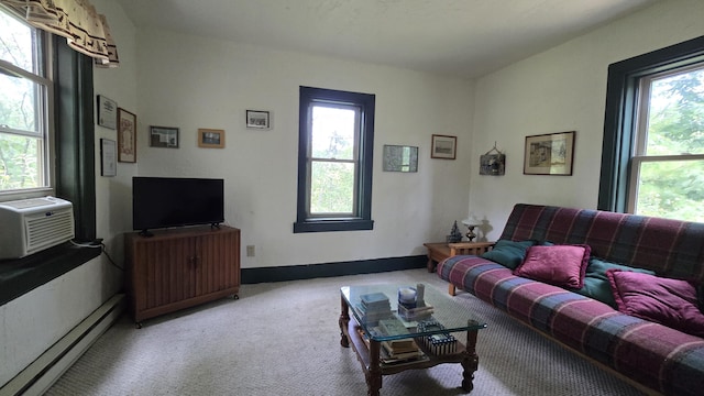 living room featuring light carpet, a baseboard radiator, and cooling unit