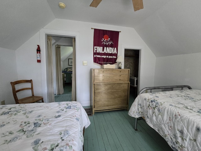 bedroom with dark hardwood / wood-style floors, ceiling fan, and lofted ceiling