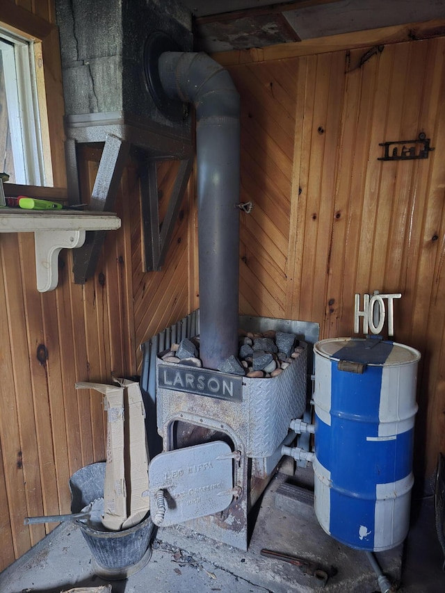 details with a wood stove and wooden walls