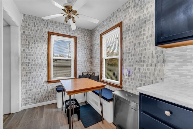 office space with ceiling fan, plenty of natural light, and light hardwood / wood-style flooring