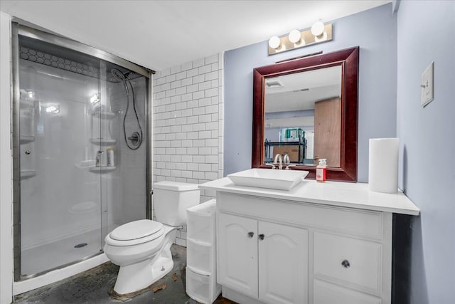 bathroom with vanity, an enclosed shower, and toilet