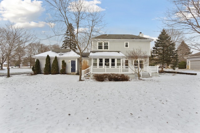 view of snow covered house