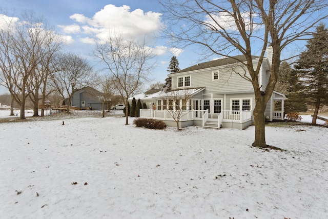 view of snow covered house