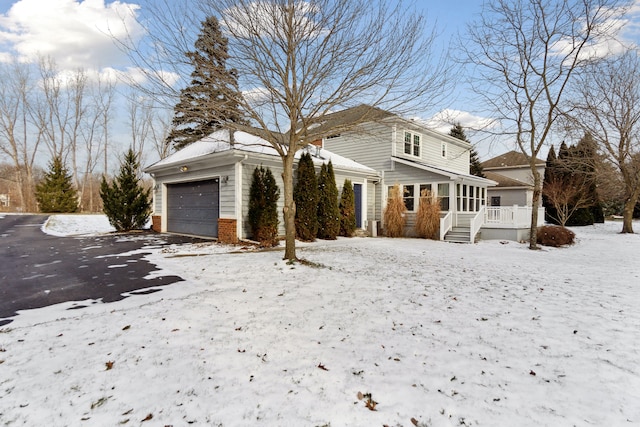 view of front of house with a garage and a deck