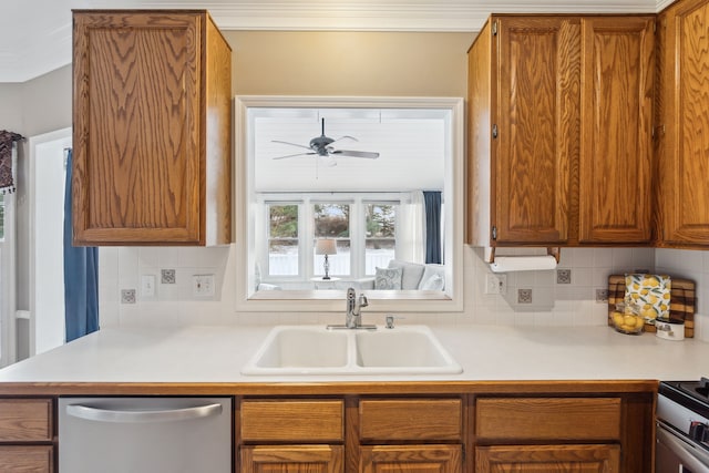 kitchen featuring backsplash, ceiling fan, sink, and appliances with stainless steel finishes