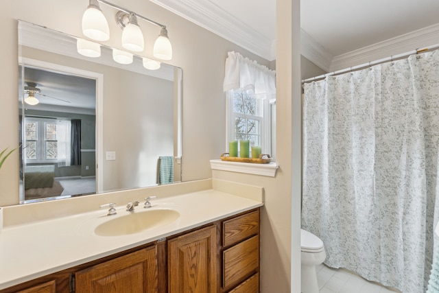 bathroom with vanity, tile patterned floors, ceiling fan, toilet, and ornamental molding