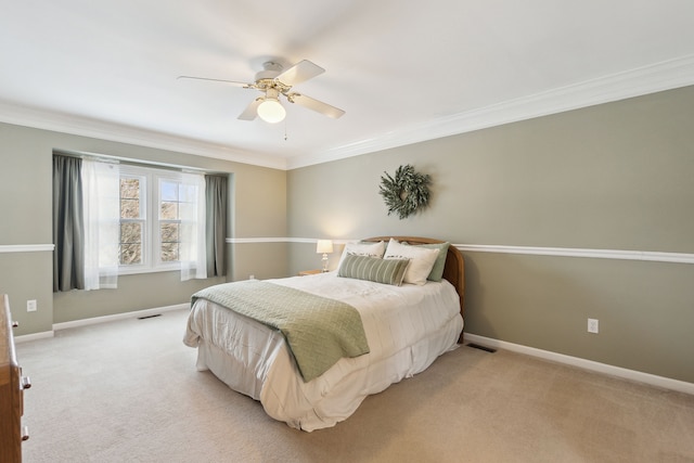 bedroom featuring carpet floors, ceiling fan, and crown molding