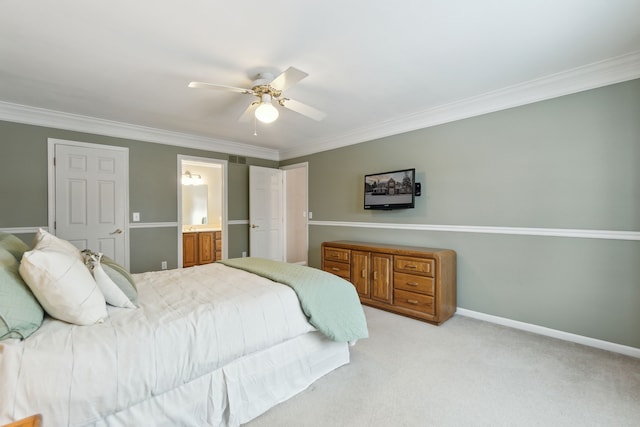 carpeted bedroom featuring ensuite bathroom, ceiling fan, and crown molding