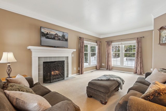 living room with a tiled fireplace, light colored carpet, and ornamental molding