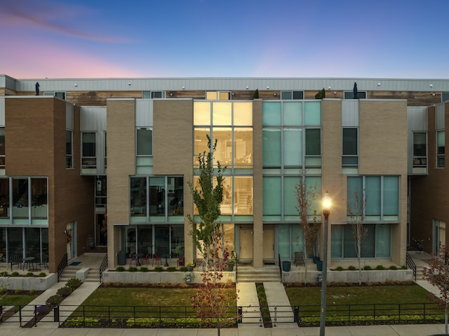 view of outdoor building at dusk