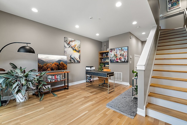 office with light hardwood / wood-style floors