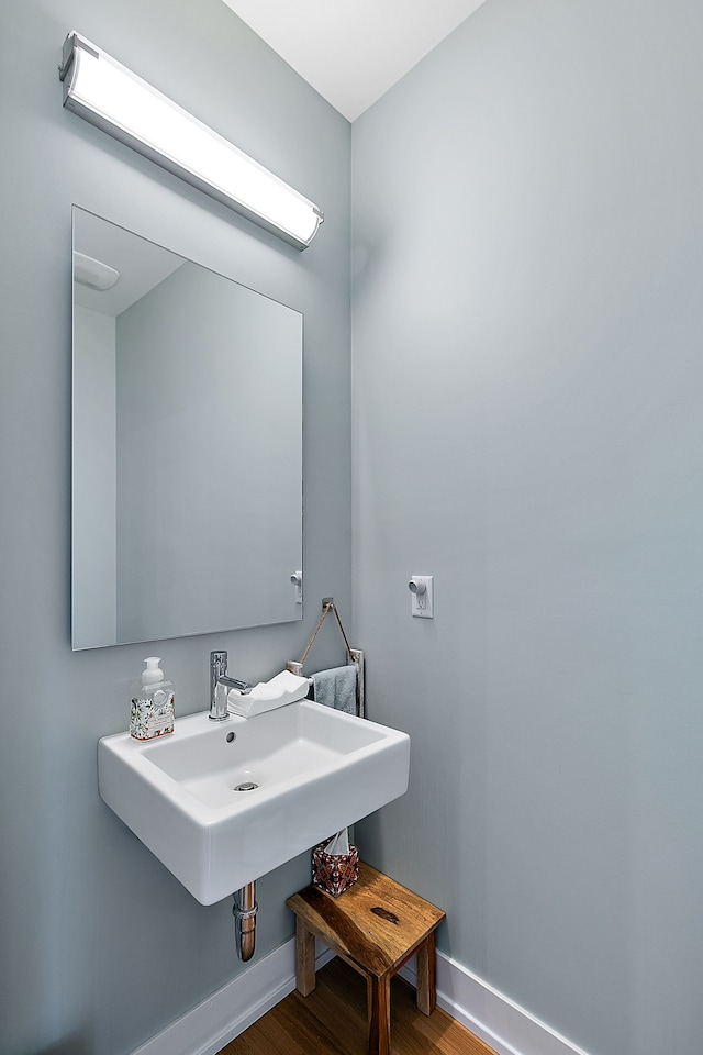 bathroom with sink and hardwood / wood-style floors