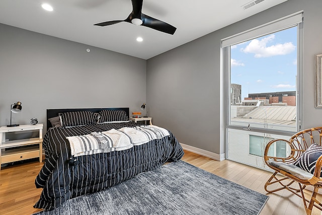 bedroom featuring light wood-type flooring and ceiling fan