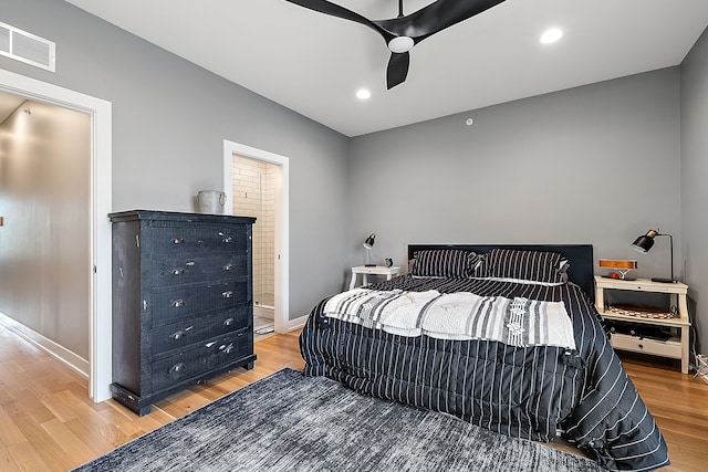 bedroom with hardwood / wood-style flooring and ceiling fan