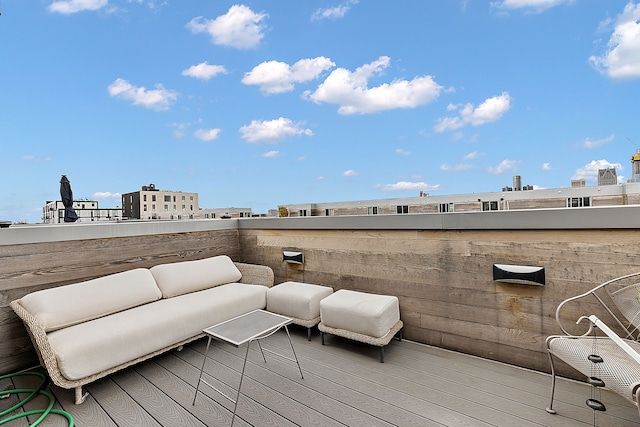 wooden terrace featuring an outdoor living space