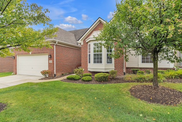 view of front of home featuring a garage and a front lawn