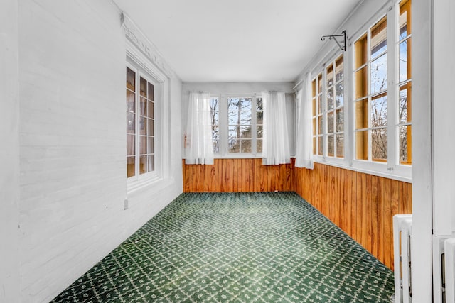 unfurnished sunroom with radiator