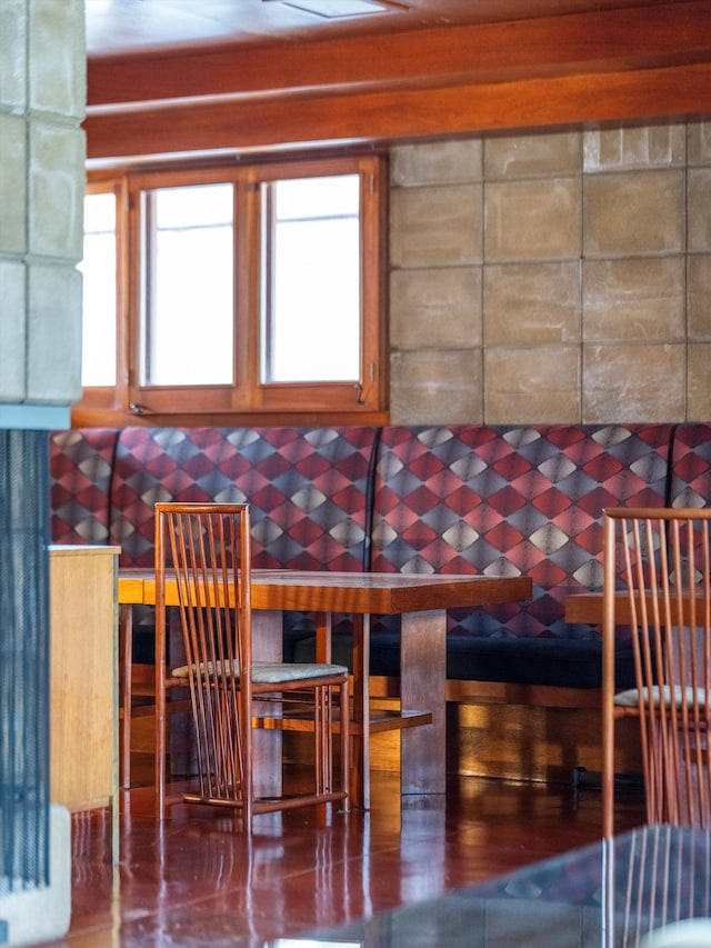 unfurnished dining area featuring concrete flooring