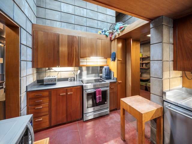 kitchen featuring tasteful backsplash and stainless steel range with electric cooktop