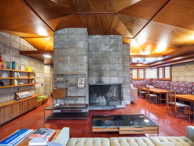 living room featuring a fireplace and vaulted ceiling