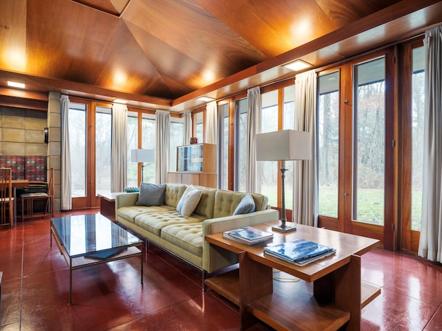 living room with plenty of natural light, vaulted ceiling, and wood ceiling