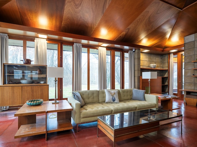 living room with wood walls and vaulted ceiling